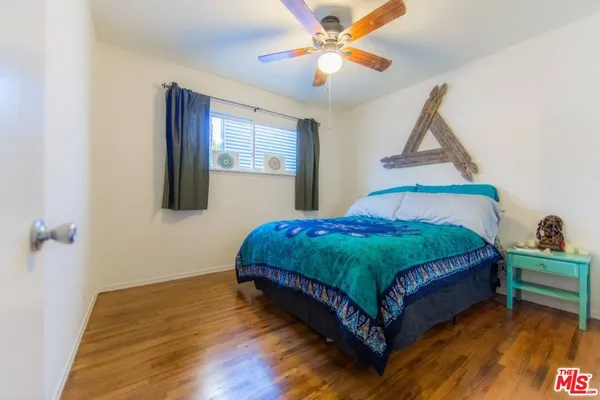 a bedroom with a bed and a table