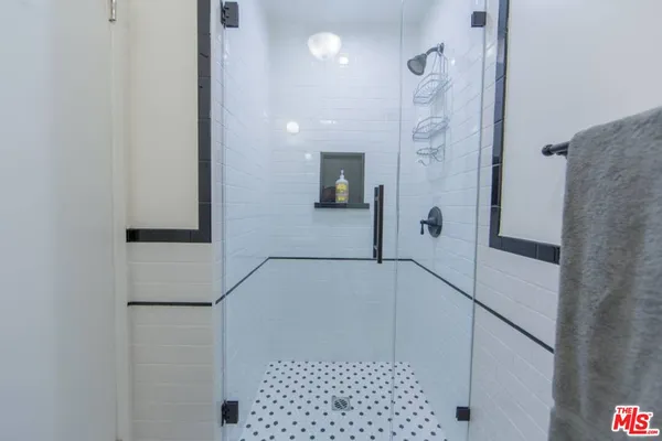 a bathroom with a bathtub and a shower