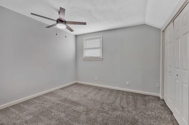 a view of a big room with carpet