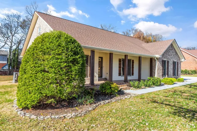 a front view of a house with garden