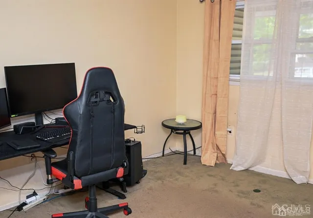 a room with furniture and a flat screen tv