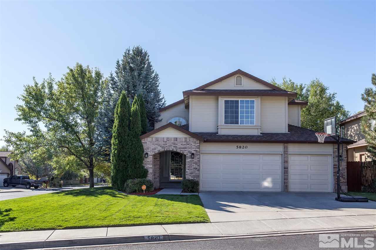 5820 Blue Horizon Drive Reno, NV 89523 - Photo 1 of 1 a front view of a house with a yard and garage