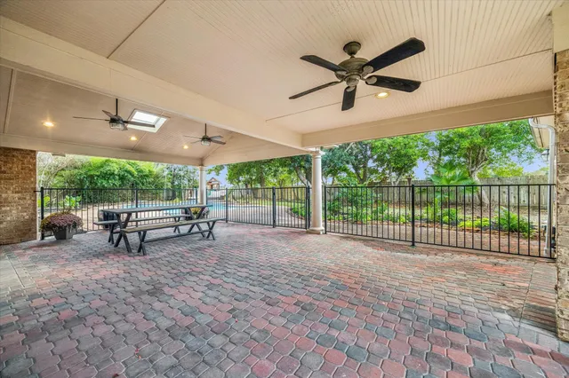 a view of a patio with a table and chairs
