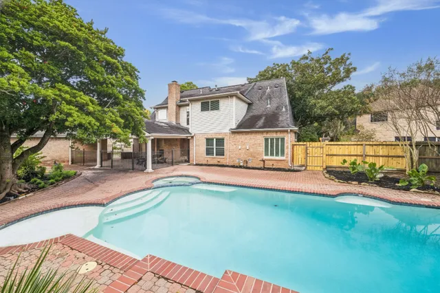 a front view of a house with a yard table and chairs
