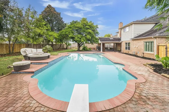 a view of a swimming pool with lounge chair
