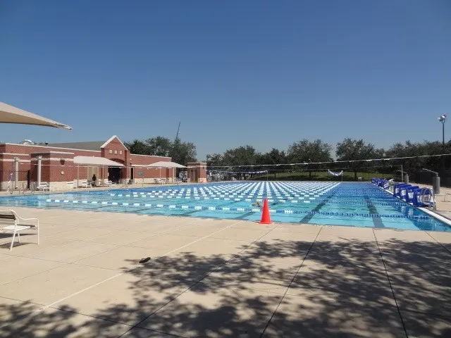 a view of swimming pool with a yard