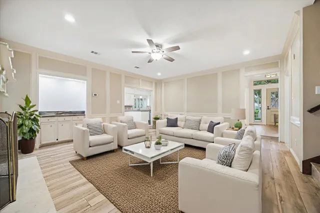 a living room with furniture or couch and a chandelier