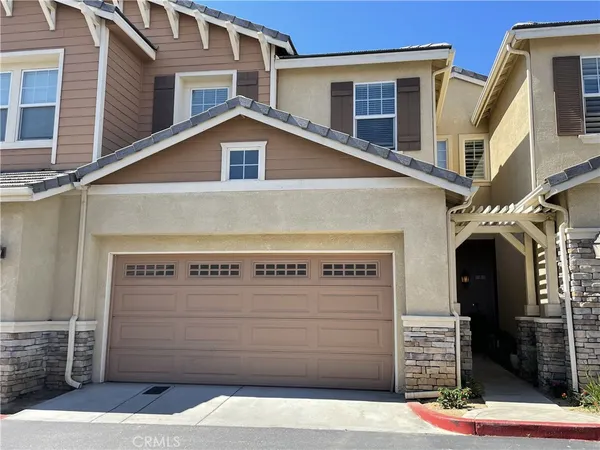 a front view of a house with garage