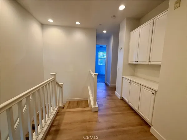 an empty room with window and mirror