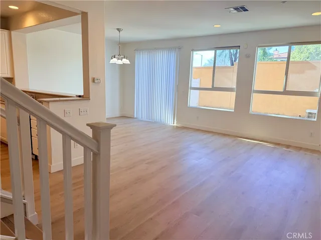a view of an entryway with wooden floor and a window