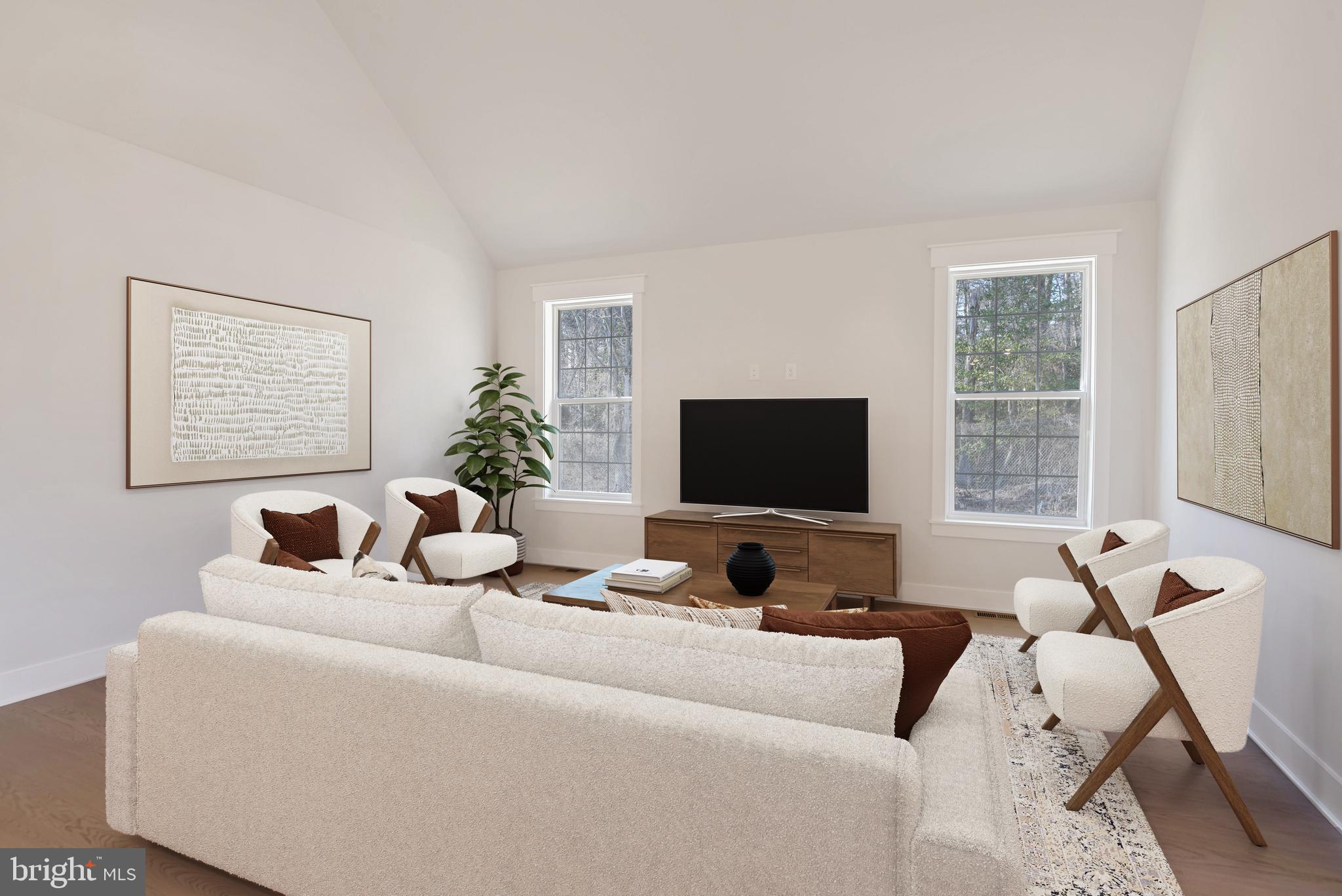 11309 Eliana Court Laurel, MD 20708 - Photo 11 of 48 a living room with furniture a flat screen tv and a large window