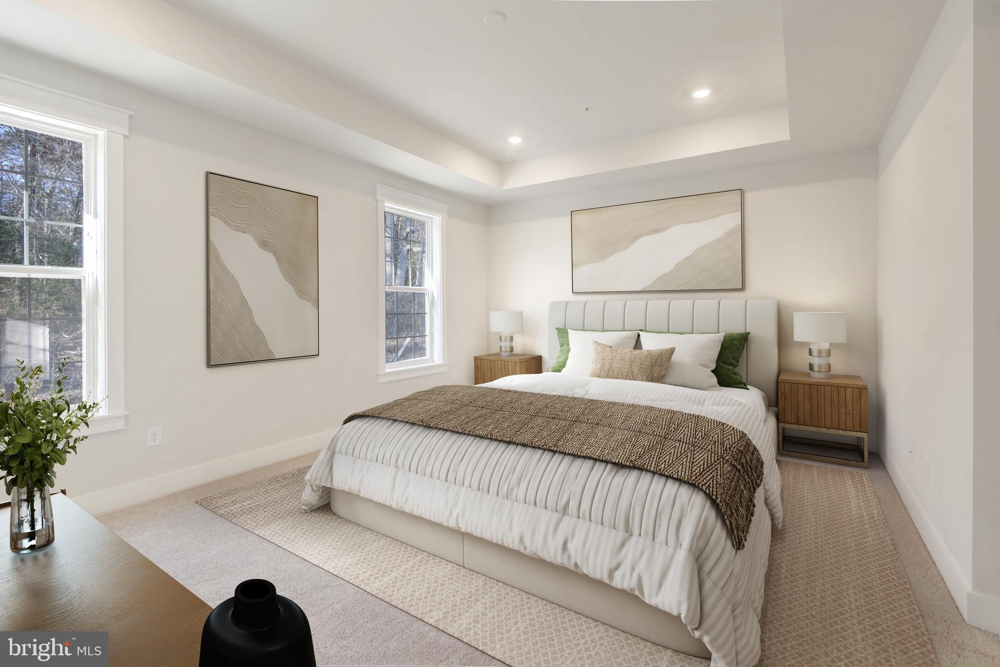 11309 Eliana Court Laurel, MD 20708 - Photo 19 of 48 a bedroom with a large bed and a potted plant