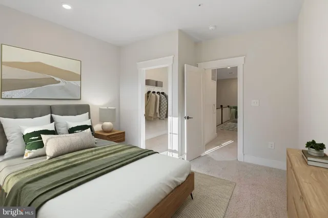 a bedroom with a bed and a mirror