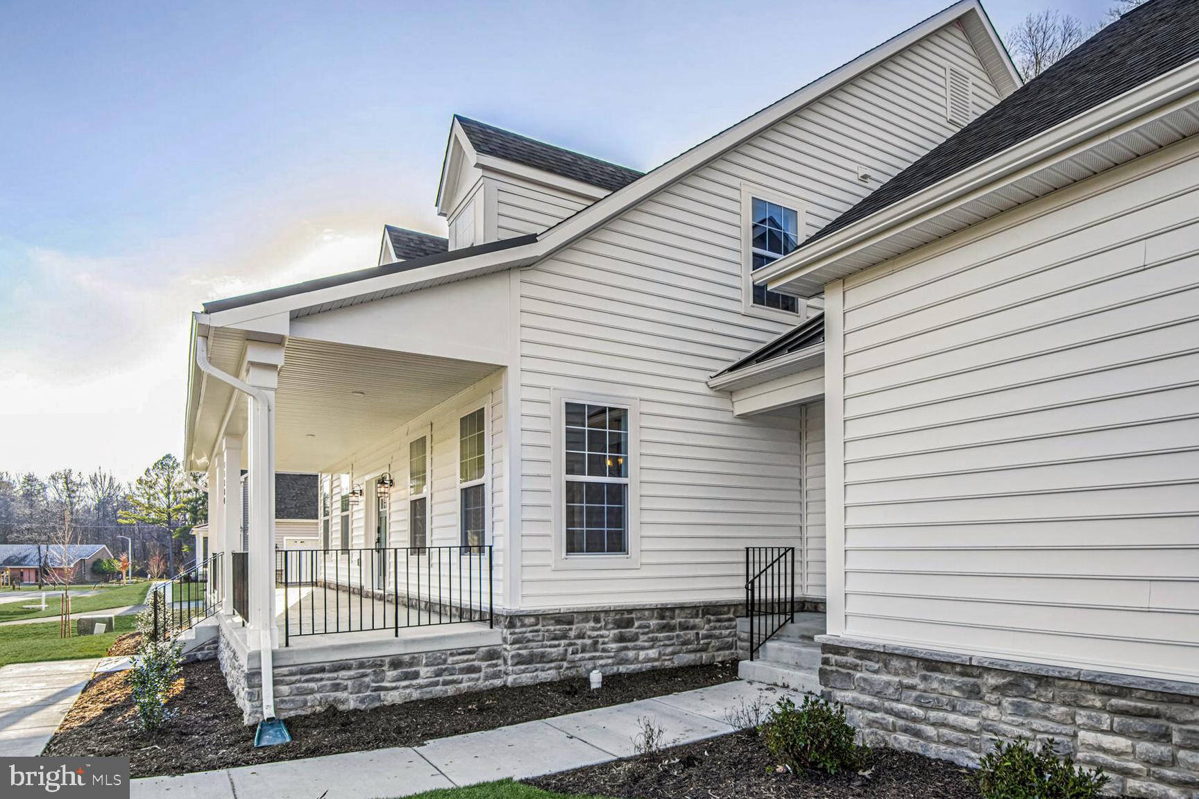 11309 Eliana Court Laurel, MD 20708 - Photo 39 of 48 a front view of a house with a garden