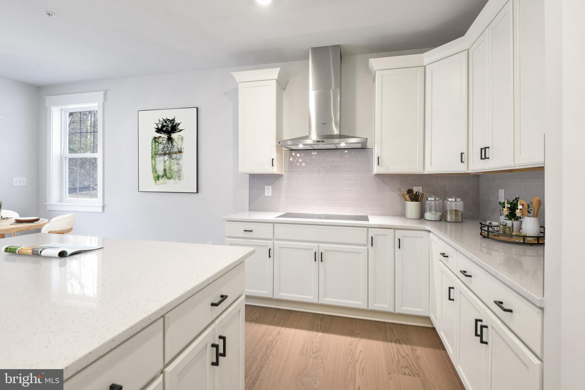 11309 Eliana Court Laurel, MD 20708 - Photo 7 of 48 a kitchen with granite countertop white cabinets white appliances and sink