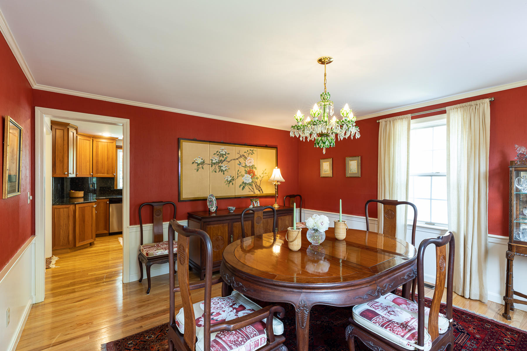 1122 Old Post Road Cotuit, MA 02635 - Photo 11 of 32 a dining room with furniture a chandelier and wooden floor