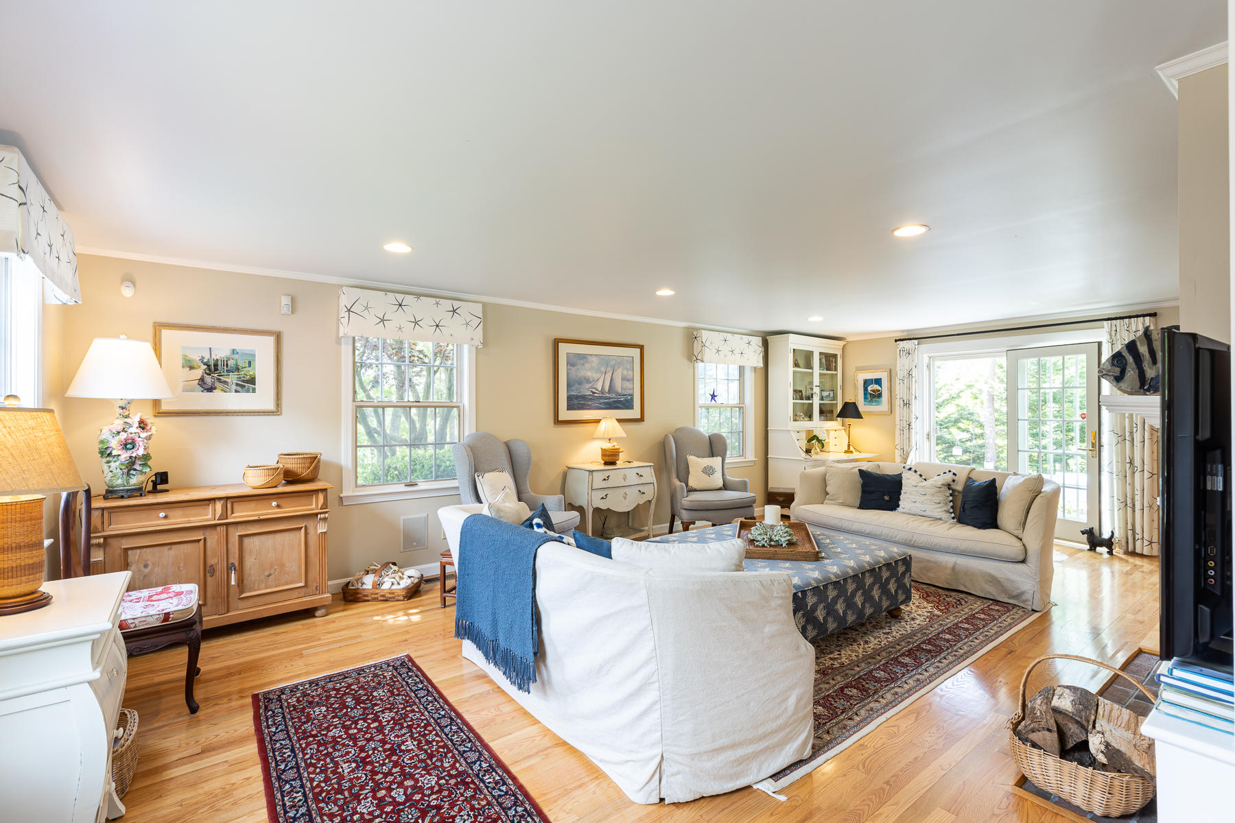 1122 Old Post Road Cotuit, MA 02635 - Photo 14 of 32 a living room with furniture large window and wooden floor