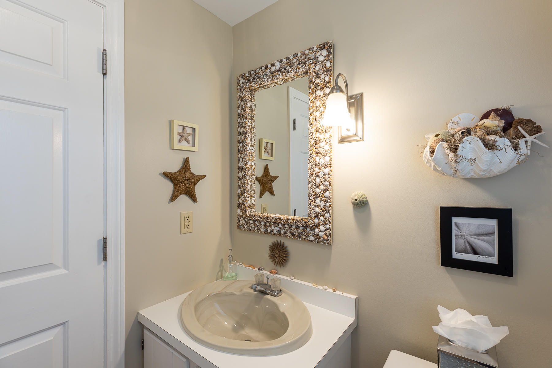 1122 Old Post Road Cotuit, MA 02635 - Photo 16 of 32 a bathroom with a sink and a mirror