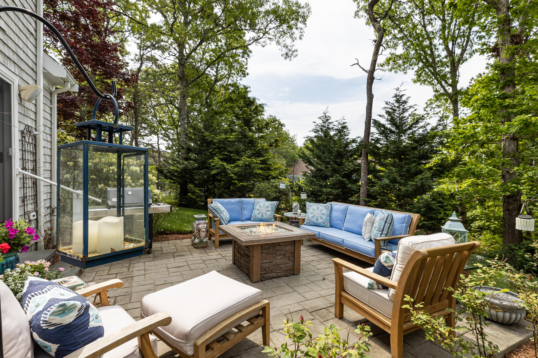 1122 Old Post Road Cotuit, MA 02635 - Photo 18 of 32 a view of a patio with couches chairs and a potted plant