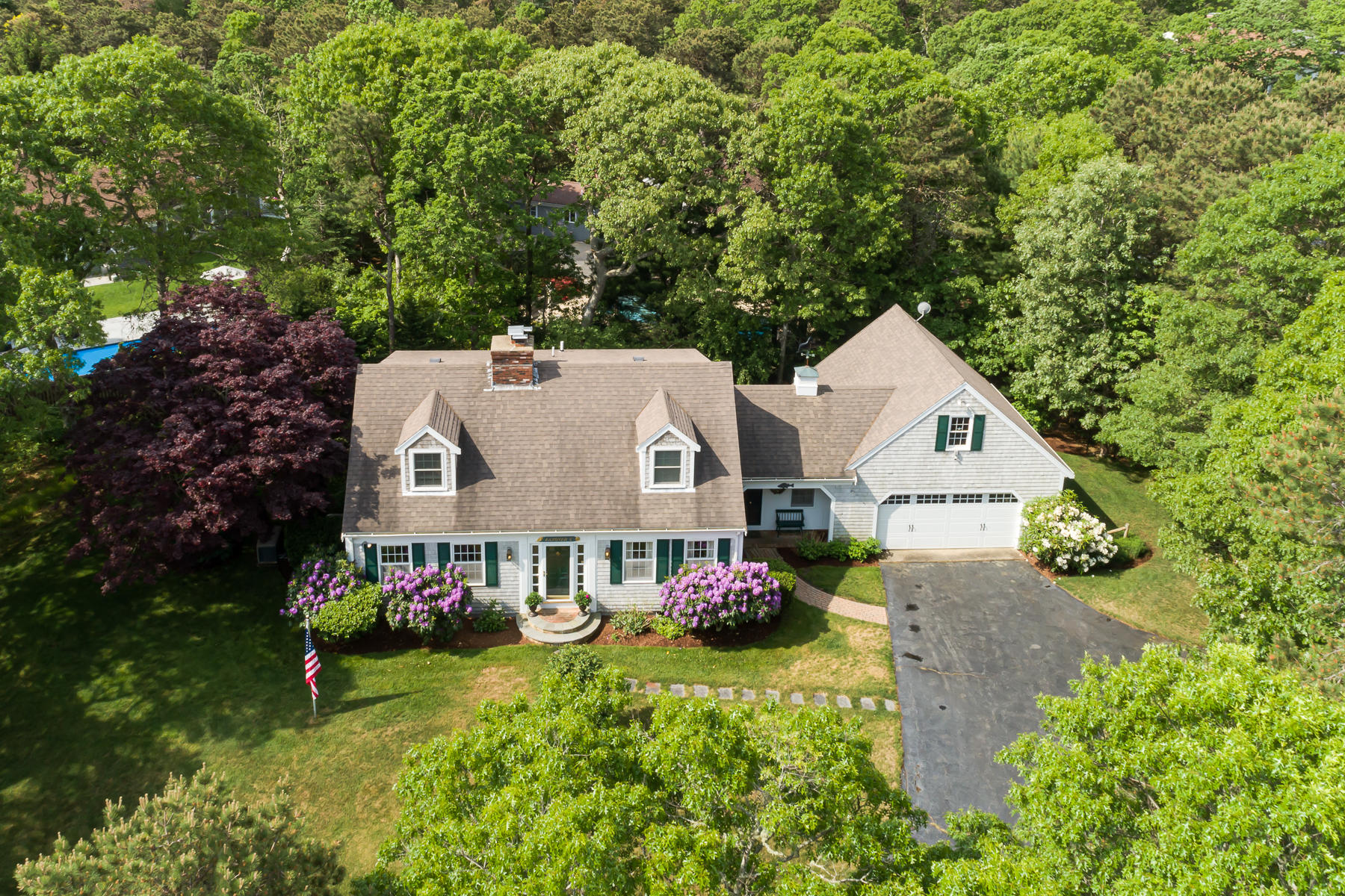 1122 Old Post Road Cotuit, MA 02635 - Photo 2 of 32 a view of an house with backyard space and garden