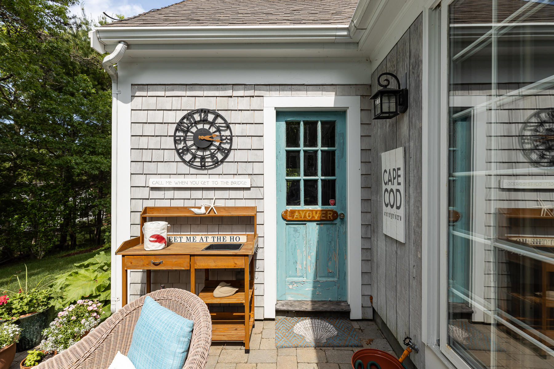 1122 Old Post Road Cotuit, MA 02635 - Photo 21 of 32 a front view of a house with entryway