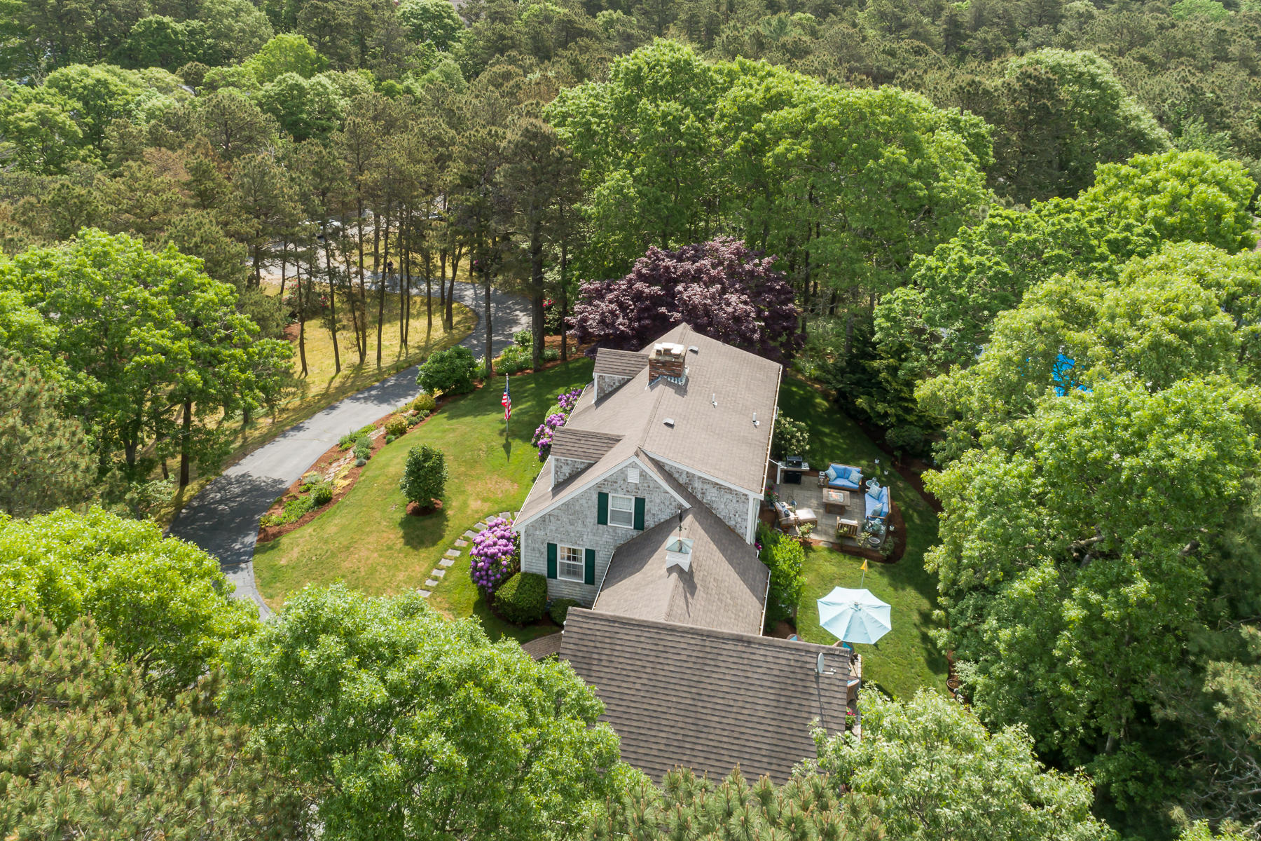 1122 Old Post Road Cotuit, MA 02635 - Photo 3 of 32 an aerial view of a house with swimming pool and garden view