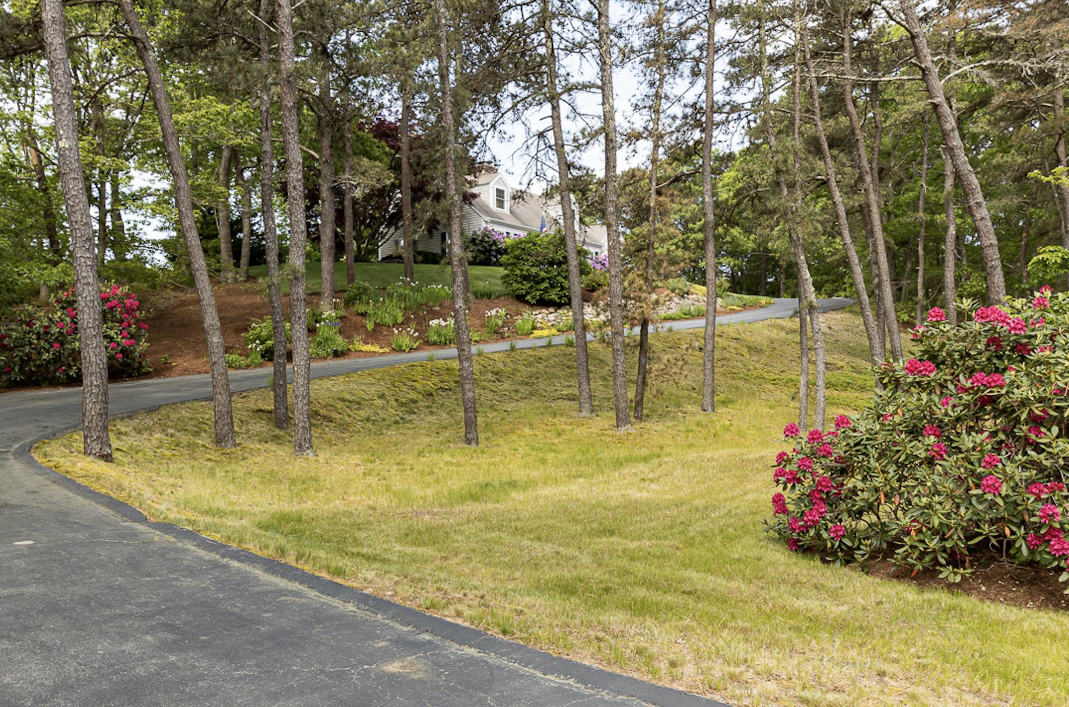 1122 Old Post Road Cotuit, MA 02635 - Photo 5 of 32 a view of a swimming pool with an outdoor seating