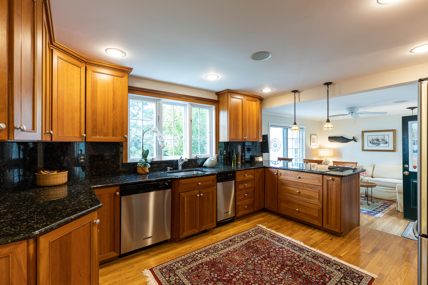 1122 Old Post Road Cotuit, MA 02635 - Photo 8 of 32 a kitchen with stainless steel appliances granite countertop a stove a sink and a refrigerator