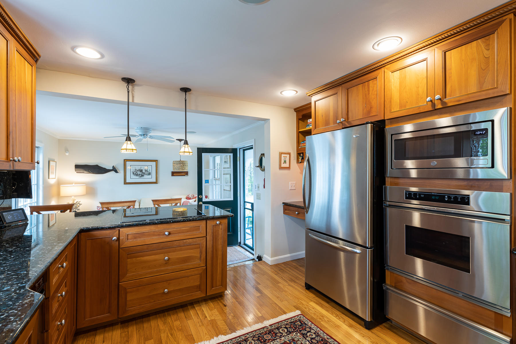 1122 Old Post Road Cotuit, MA 02635 - Photo 9 of 32 a kitchen with stainless steel appliances granite countertop a refrigerator and a stove