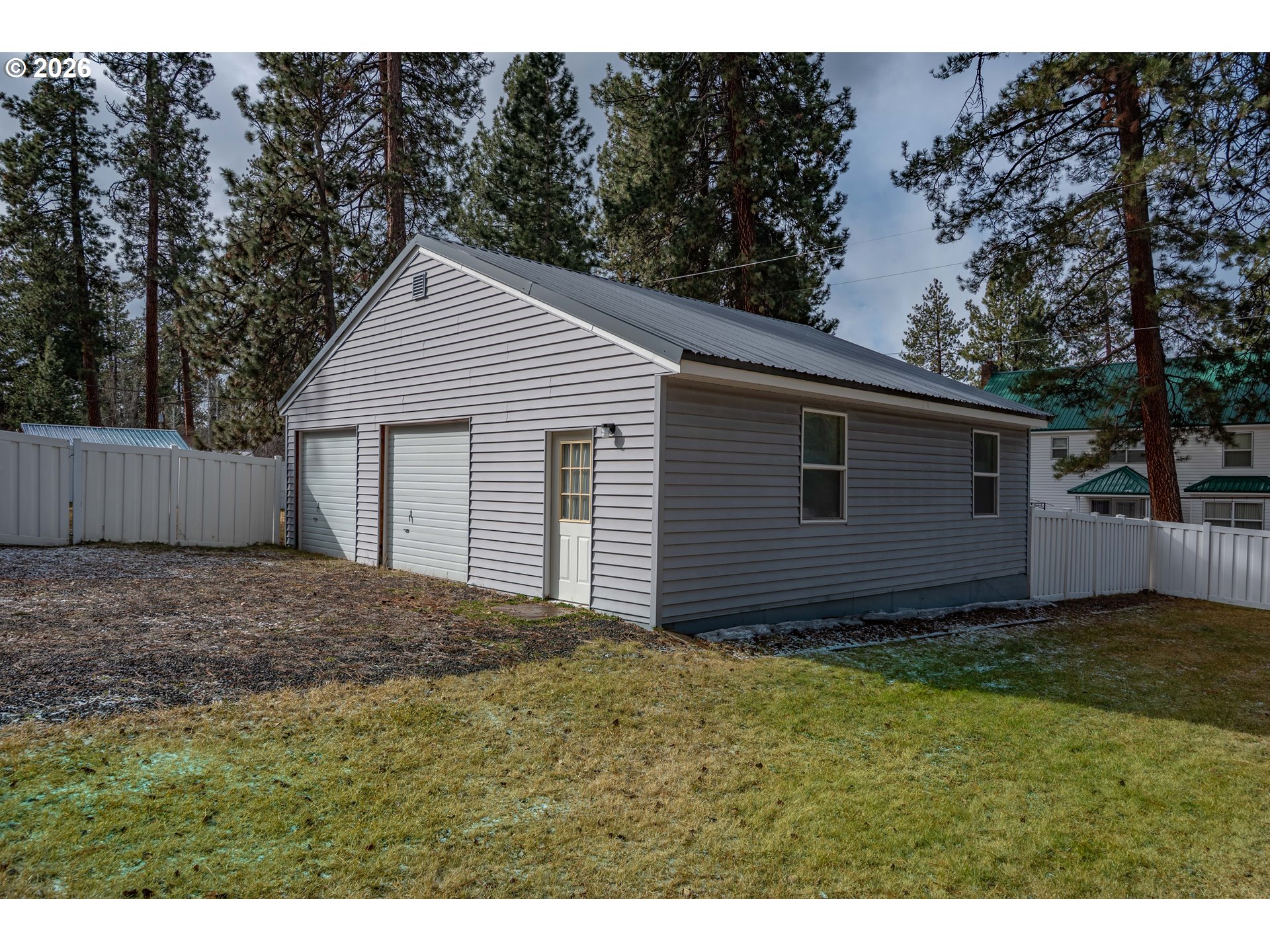 138722 Rhododendron Street Gilchrist, OR 97737 - Photo 17 of 27 a view of a house with a yard