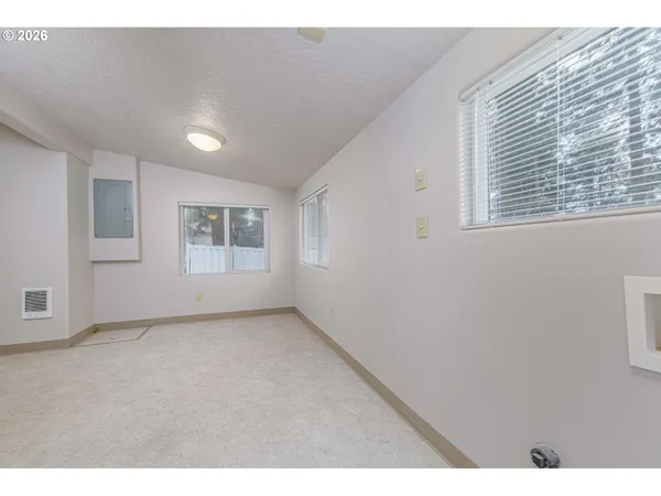 a view of an empty room with a window