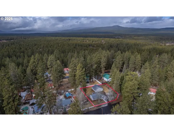 a aerial view of a house with a yard