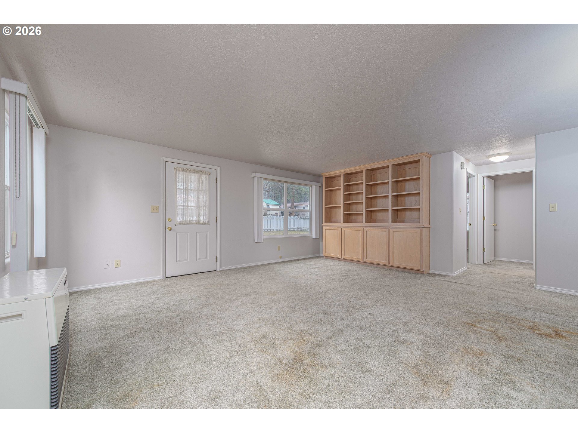 138722 Rhododendron Street Gilchrist, OR 97737 - Photo 21 of 27 a view of an empty room with a window