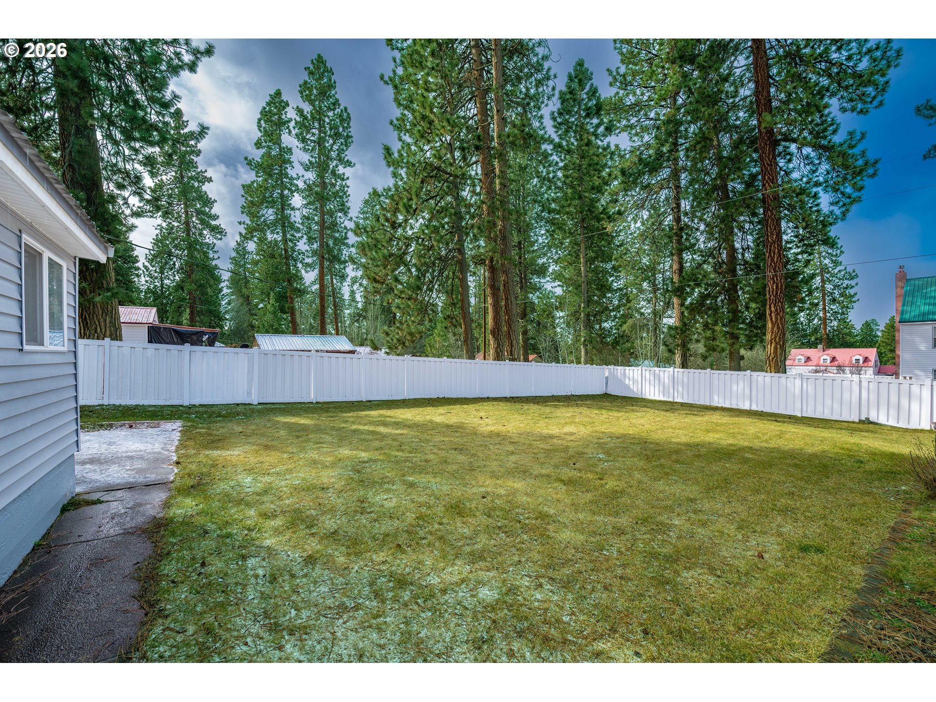 138722 Rhododendron Street Gilchrist, OR 97737 - Photo 5 of 27 a view of yard with swimming pool and trees in the background