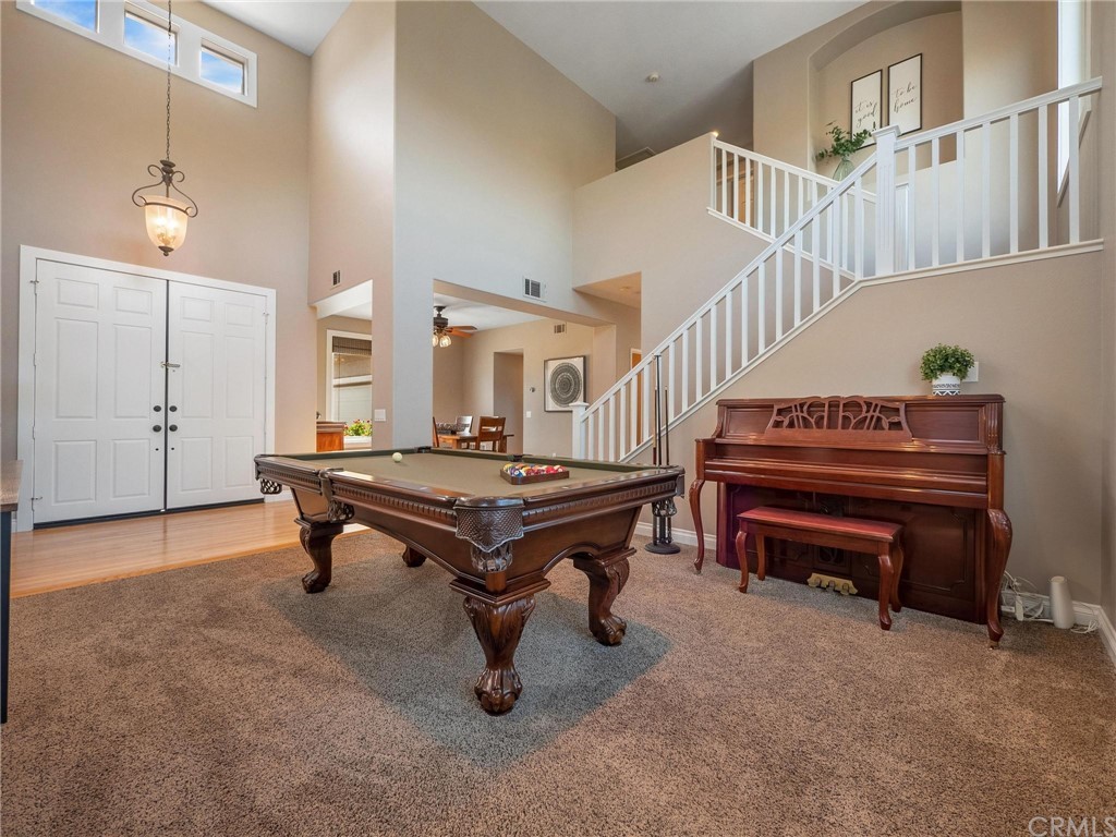 2 Whippoorwill Road Trabuco Canyon, CA 92679 - Photo 11 of 57 a room with lots of furniture and a piano