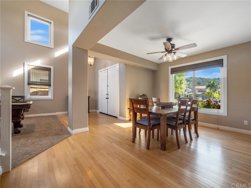 2 Whippoorwill Road Trabuco Canyon, CA 92679 - Photo 13 of 57 a view of a dining room with furniture window and wooden floor