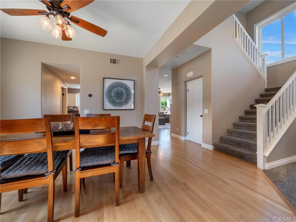 2 Whippoorwill Road Trabuco Canyon, CA 92679 - Photo 15 of 57 a view of a dining room with furniture and wooden floor