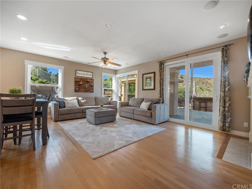 2 Whippoorwill Road Trabuco Canyon, CA 92679 - Photo 16 of 57 a living room with furniture large windows and wooden floor