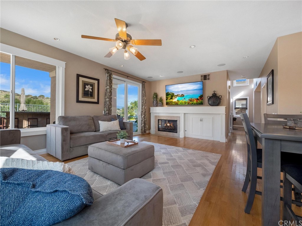 2 Whippoorwill Road Trabuco Canyon, CA 92679 - Photo 18 of 57 a living room with furniture and a fireplace