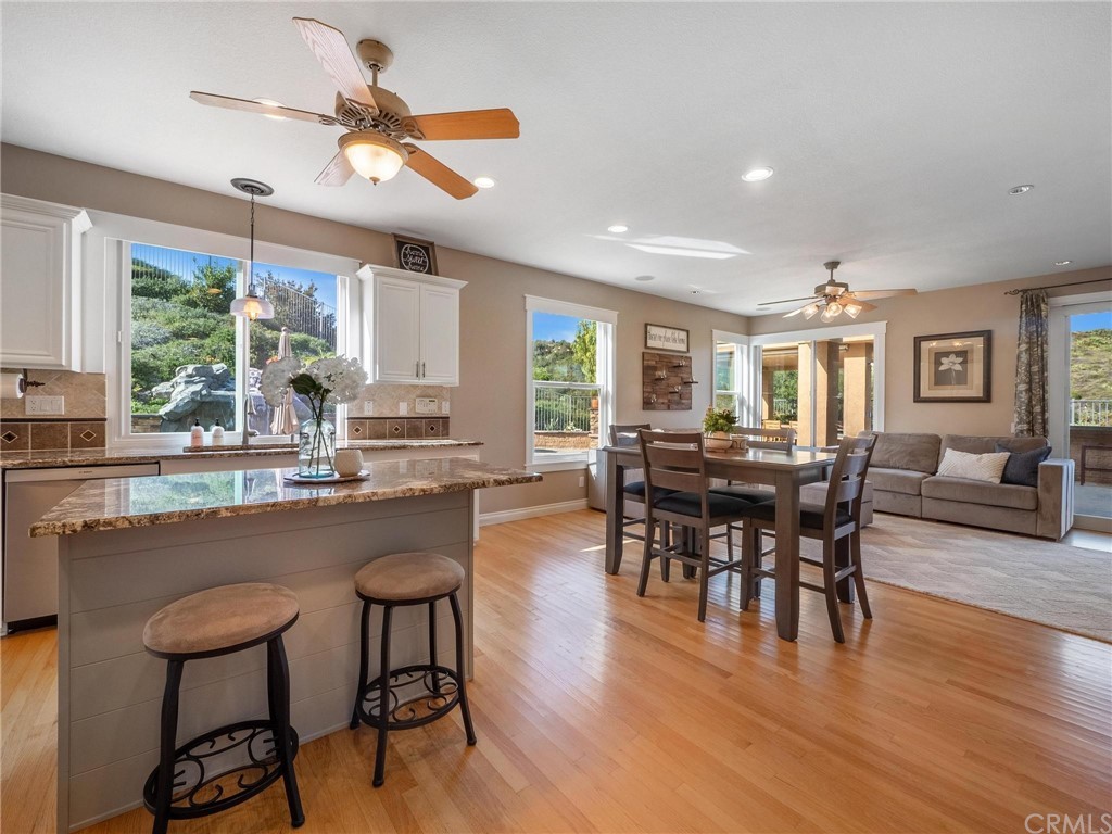2 Whippoorwill Road Trabuco Canyon, CA 92679 - Photo 19 of 57 a view of a dining room with furniture window and wooden floor