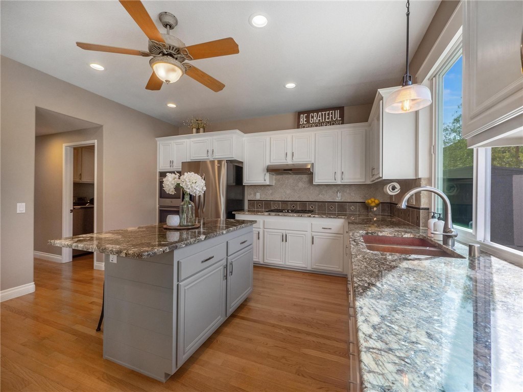 2 Whippoorwill Road Trabuco Canyon, CA 92679 - Photo 21 of 57 a kitchen with stainless steel appliances granite countertop a sink and cabinets