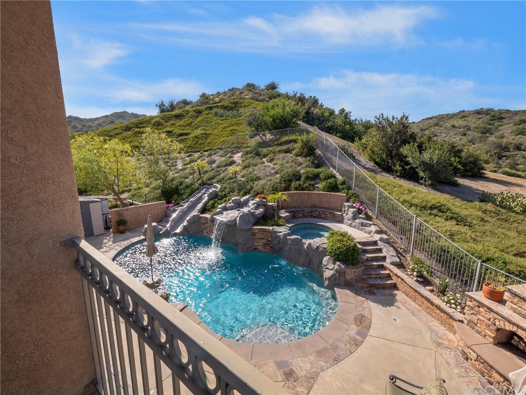 2 Whippoorwill Road Trabuco Canyon, CA 92679 - Photo 27 of 57 a view of a balcony with an outdoor space and seating area