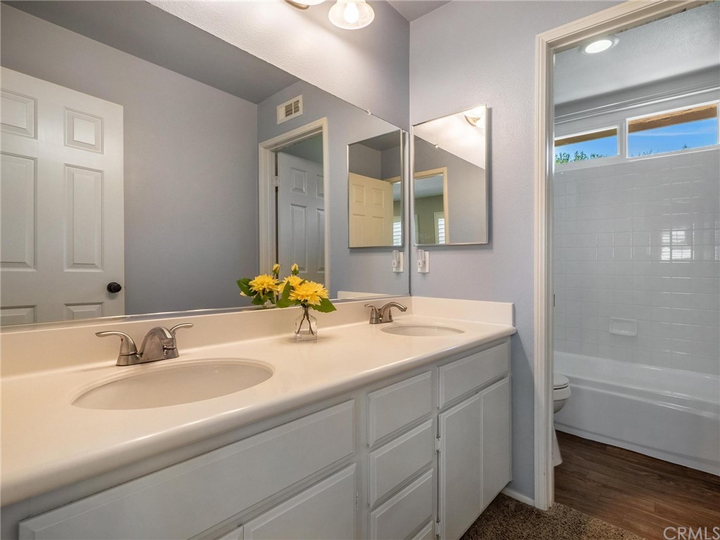 2 Whippoorwill Road Trabuco Canyon, CA 92679 - Photo 38 of 57 a bathroom with a sink and a mirror