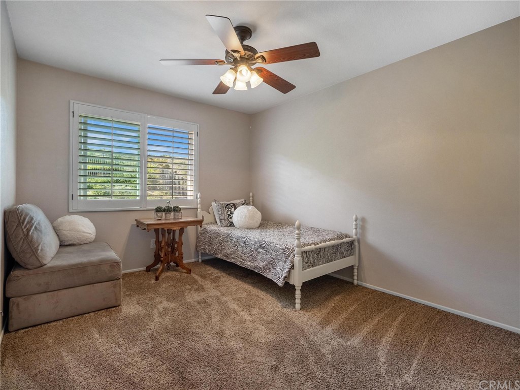 2 Whippoorwill Road Trabuco Canyon, CA 92679 - Photo 39 of 57 a bedroom with furniture and a ceiling fan