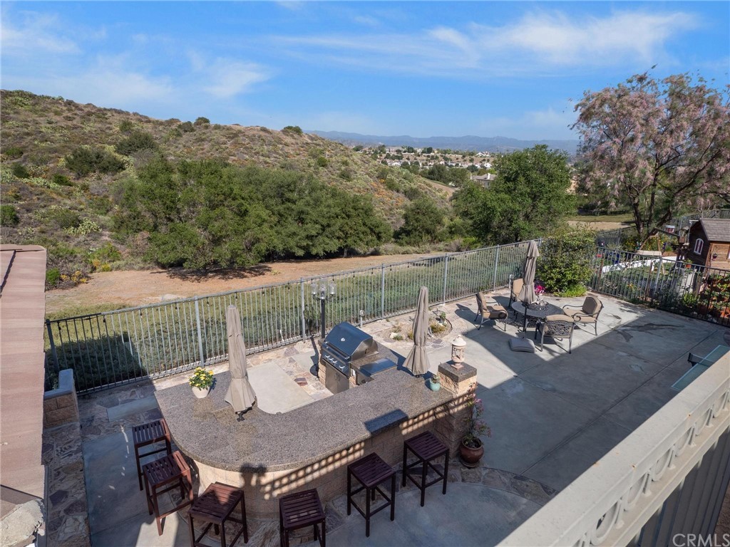 2 Whippoorwill Road Trabuco Canyon, CA 92679 - Photo 4 of 57 a view of a couches and a table in the roof deck