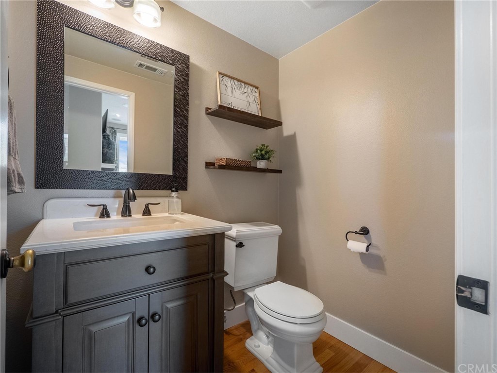 2 Whippoorwill Road Trabuco Canyon, CA 92679 - Photo 41 of 57 a bathroom with a toilet a sink and mirror