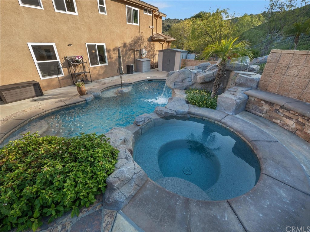 2 Whippoorwill Road Trabuco Canyon, CA 92679 - Photo 44 of 57 a view of a patio with table and chairs potted plants with wooden floor