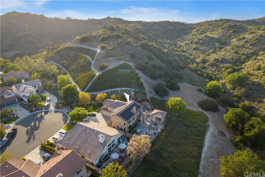 2 Whippoorwill Road Trabuco Canyon, CA 92679 - Photo 53 of 57 an aerial view of a house with a mountain