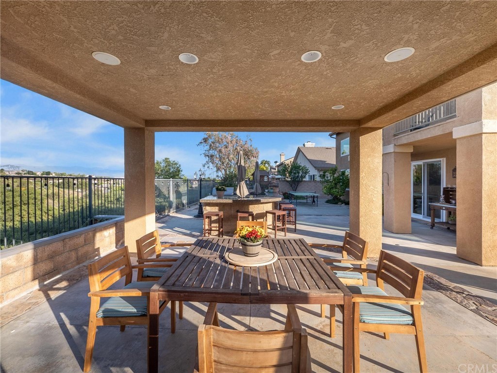 2 Whippoorwill Road Trabuco Canyon, CA 92679 - Photo 6 of 57 a view of a dining room with furniture a chandelier and wooden floor
