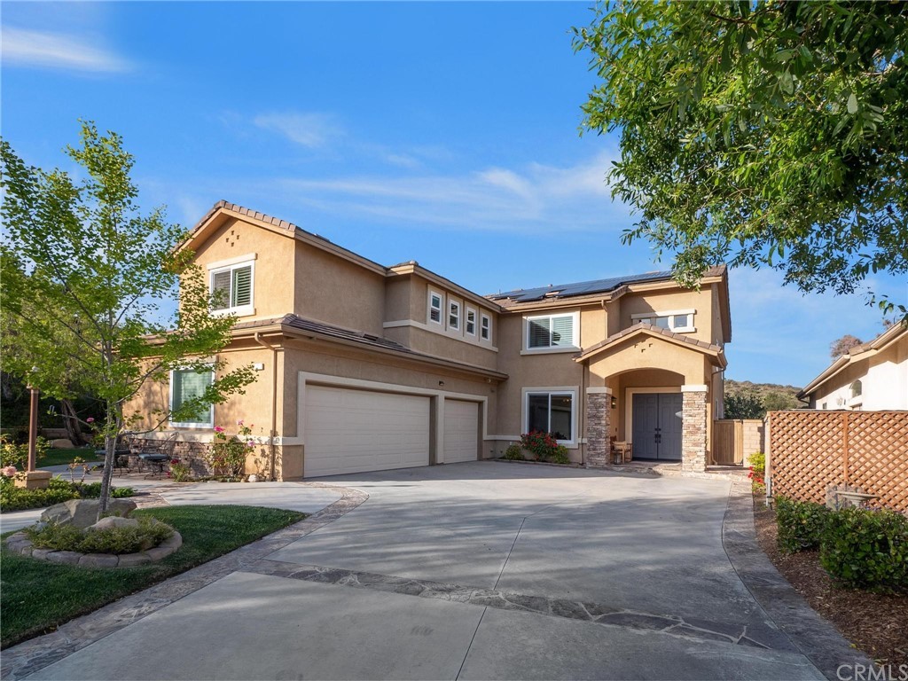 2 Whippoorwill Road Trabuco Canyon, CA 92679 - Photo 8 of 57 a front view of a house with a garden